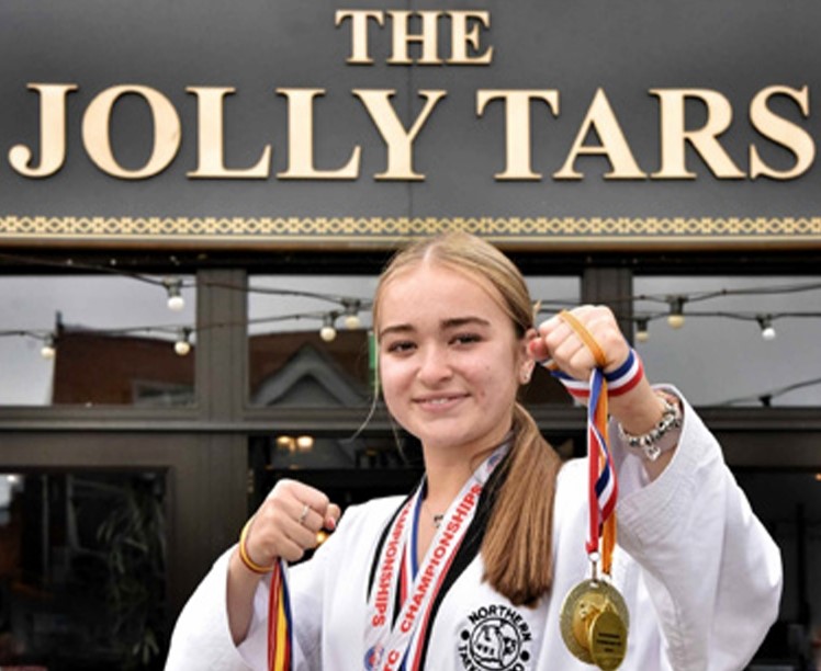 Teen Wetherspoons waitress and 4th dan black belt, Ella Heyes, balances work, A Levels, and taekwondo, earning gold at the British Championships and bronze in Europe.