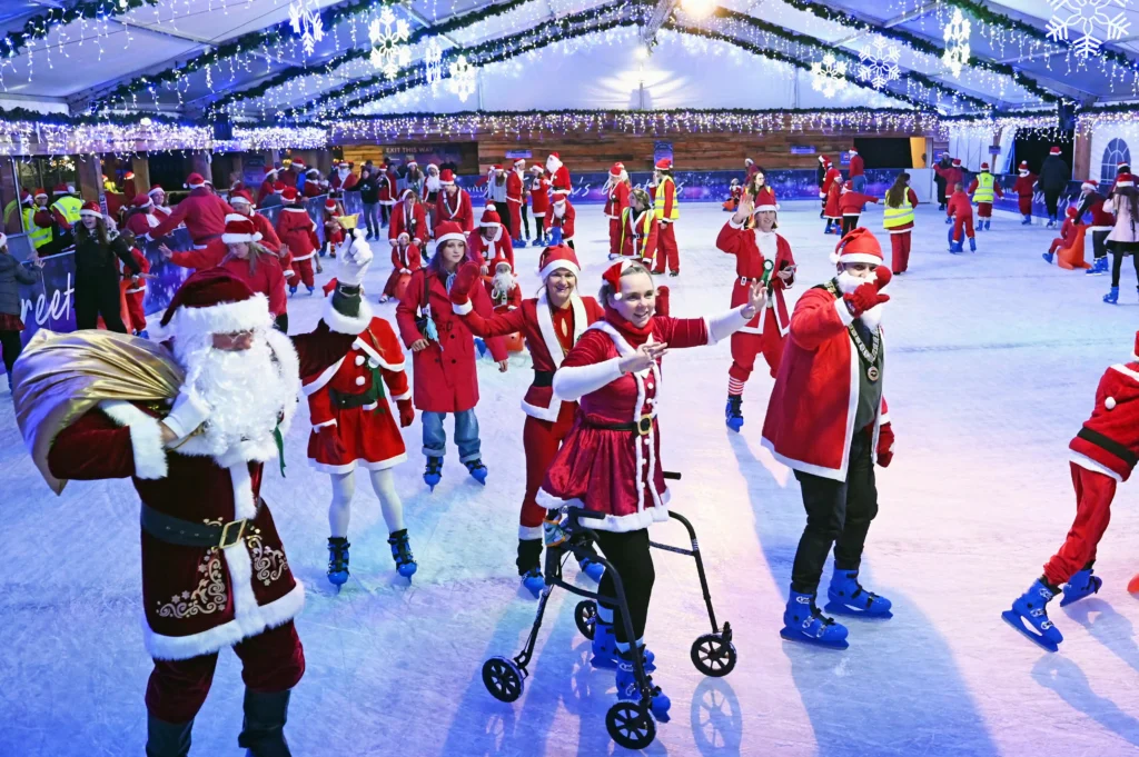 157 Santas skate into history at Clarks Village, Somerset, breaking the world record for most Santas on ice. Festive fun launches the countdown to Christmas!