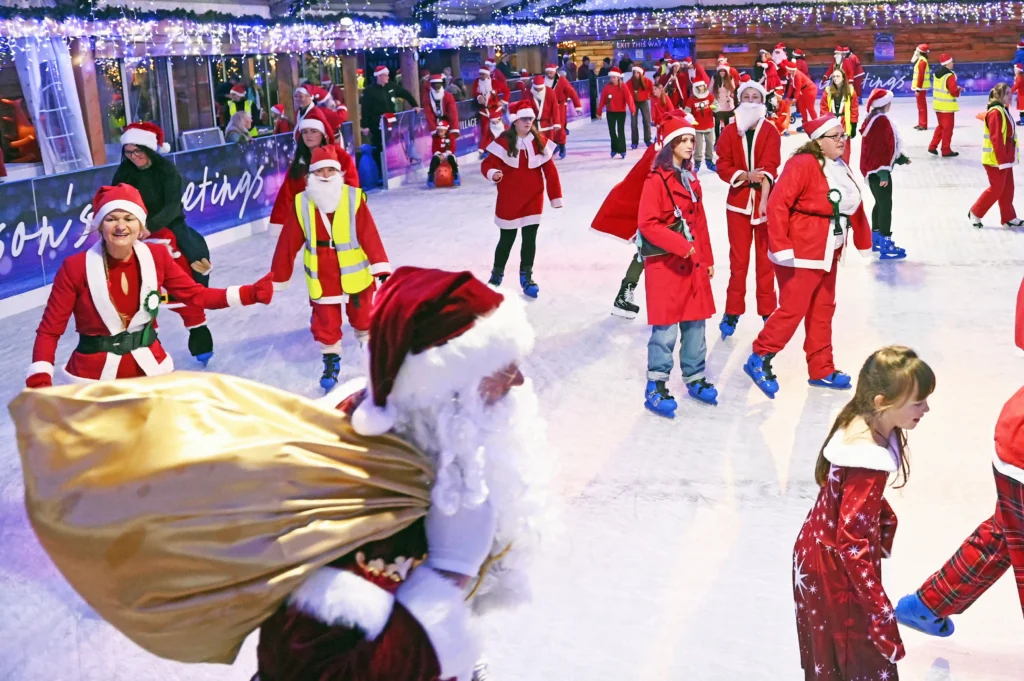 157 Santas skate into history at Clarks Village, Somerset, breaking the world record for most Santas on ice. Festive fun launches the countdown to Christmas!