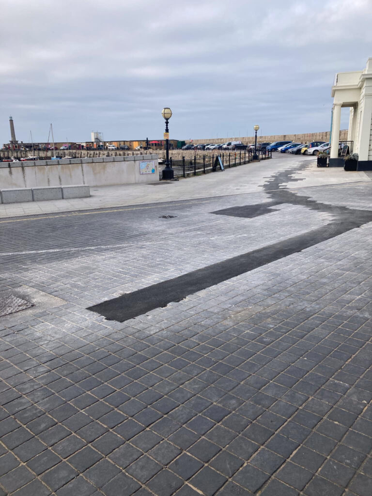 Botched paving repairs outside Margate’s Turner Contemporary spark humor, with locals calling it ‘wacky art’ while officials demand a proper fix from UK Power Network.