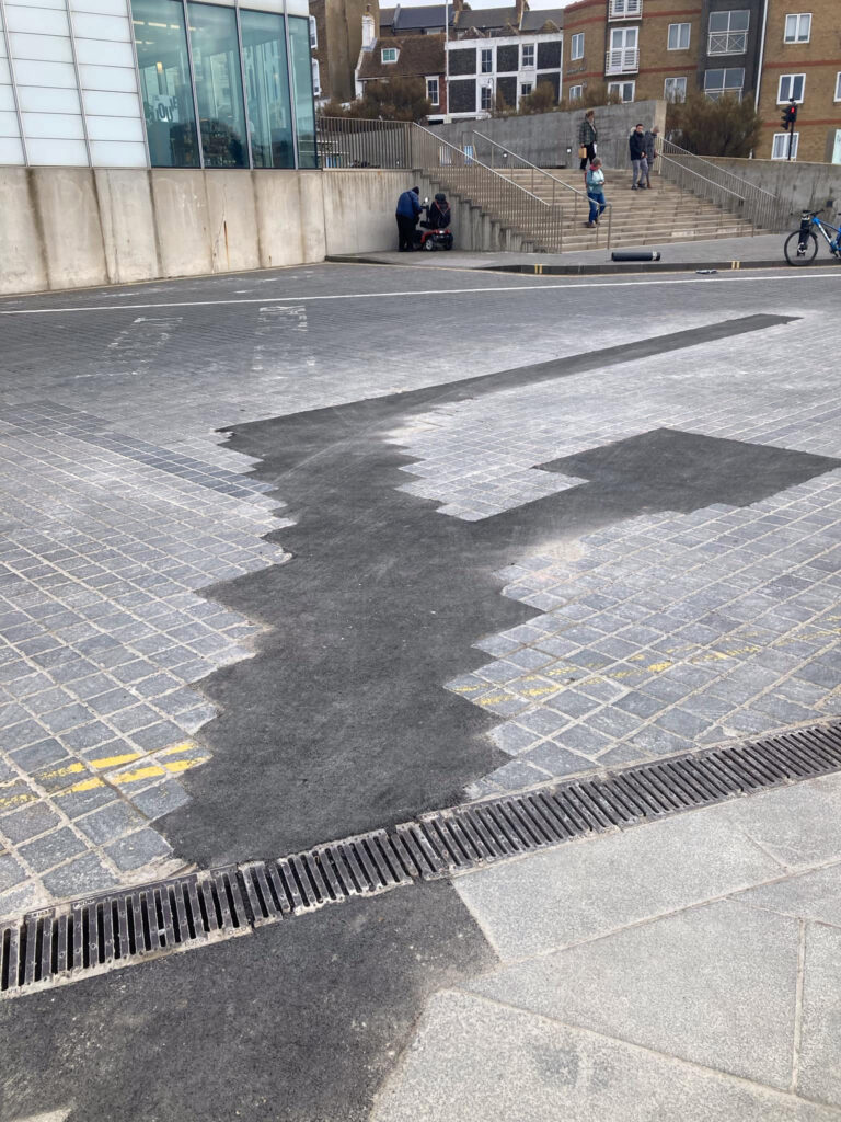 Botched paving repairs outside Margate’s Turner Contemporary spark humor, with locals calling it ‘wacky art’ while officials demand a proper fix from UK Power Network.