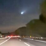 Driver in Jerez, Spain, captures mysterious illuminated "UFO" in the night sky, sparking debate online. Plane, drone, or alien craft? Video racks up 70,000 views.