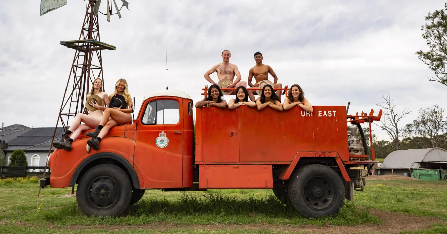 University students bare all for the 2025 "Flash for Farmers" calendar, raising funds for Rural Aid with creative nude shots featuring tractors, animals, and farm scenes.