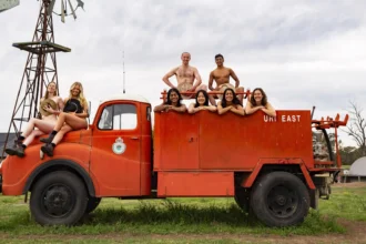 University students bare all for the 2025 "Flash for Farmers" calendar, raising funds for Rural Aid with creative nude shots featuring tractors, animals, and farm scenes.