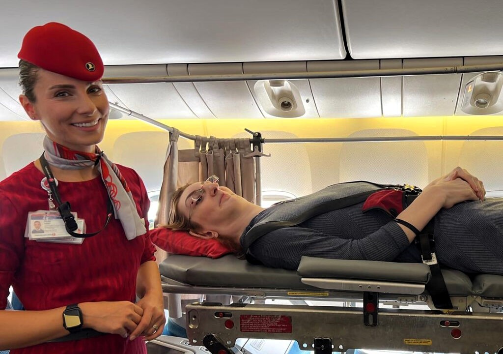 Rumeysa Gelgi, the world’s tallest woman at 7ft 0.09ins, shares her inspiring air travel journey, flying via stretcher due to her condition. A step toward accessible travel!