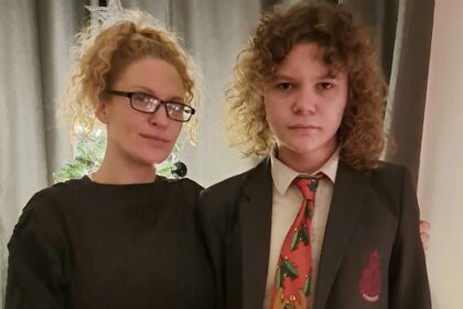 Furious mum slams school for 'cruel' punishment after her autistic son was bullied for wearing a cartoon tie. Discover the shocking story and her response!