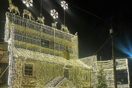 Britain's most festive home dazzles with over 200,000 Christmas lights, raising funds for veterans. Owner Richard Iles' stunning display draws praise and supports a vital cause.