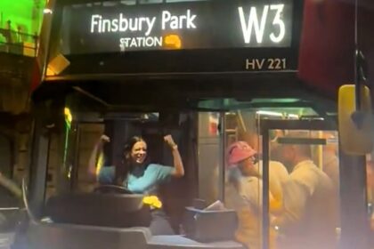 A London bus driver wowed boozy darts fans by dancing at the wheel outside Ally Pally. Revellers hailed her festive spirit, calling for a Christmas bonus!