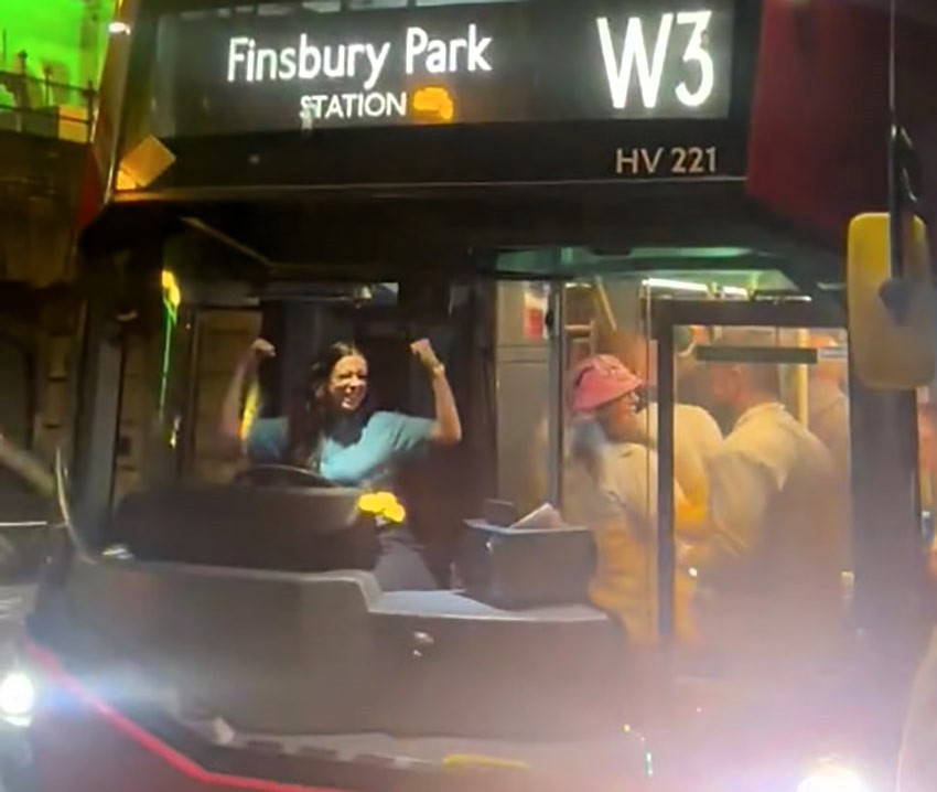 A London bus driver wowed boozy darts fans by dancing at the wheel outside Ally Pally. Revellers hailed her festive spirit, calling for a Christmas bonus!