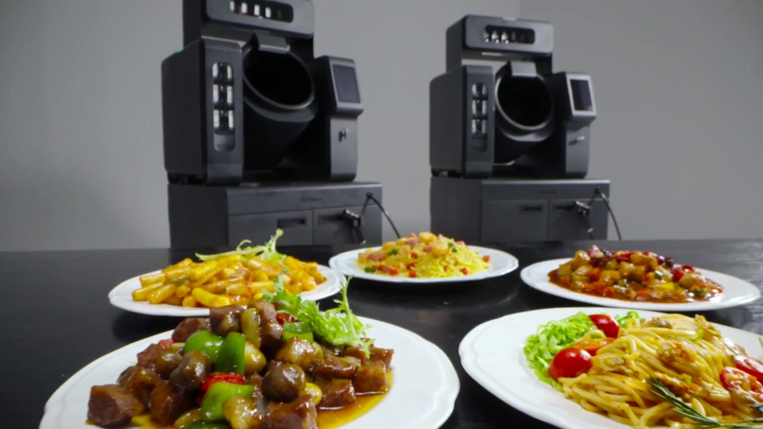 BOTINKIT's AI robot chef automates cooking tasks like stir-frying, boiling, and seasoning, aiming to cut restaurant costs by 30%. It offers precision, reducing waste and ensuring consistency.