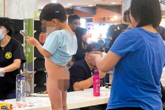 Diners were shocked as a mum changed her toddler's dirty nappy on a dining bench at a busy Singapore restaurant, sparking complaints about hygiene and public etiquette.