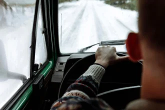 Drivers singing along to festive hits like Smithy in *Gavin & Stacey* risk £5,000 fines if loud music distracts them, warns motoring experts amid holiday road safety concerns.