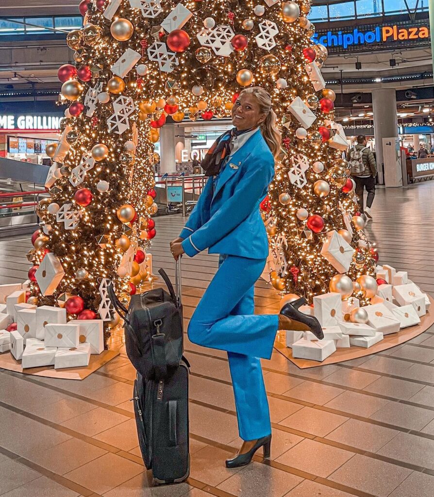 Flight attendant Esther Sturrus shares festive travel hacks: book midweek, use airline apps for discounts, consider connecting flights, and pack smart for stress-free holidays!