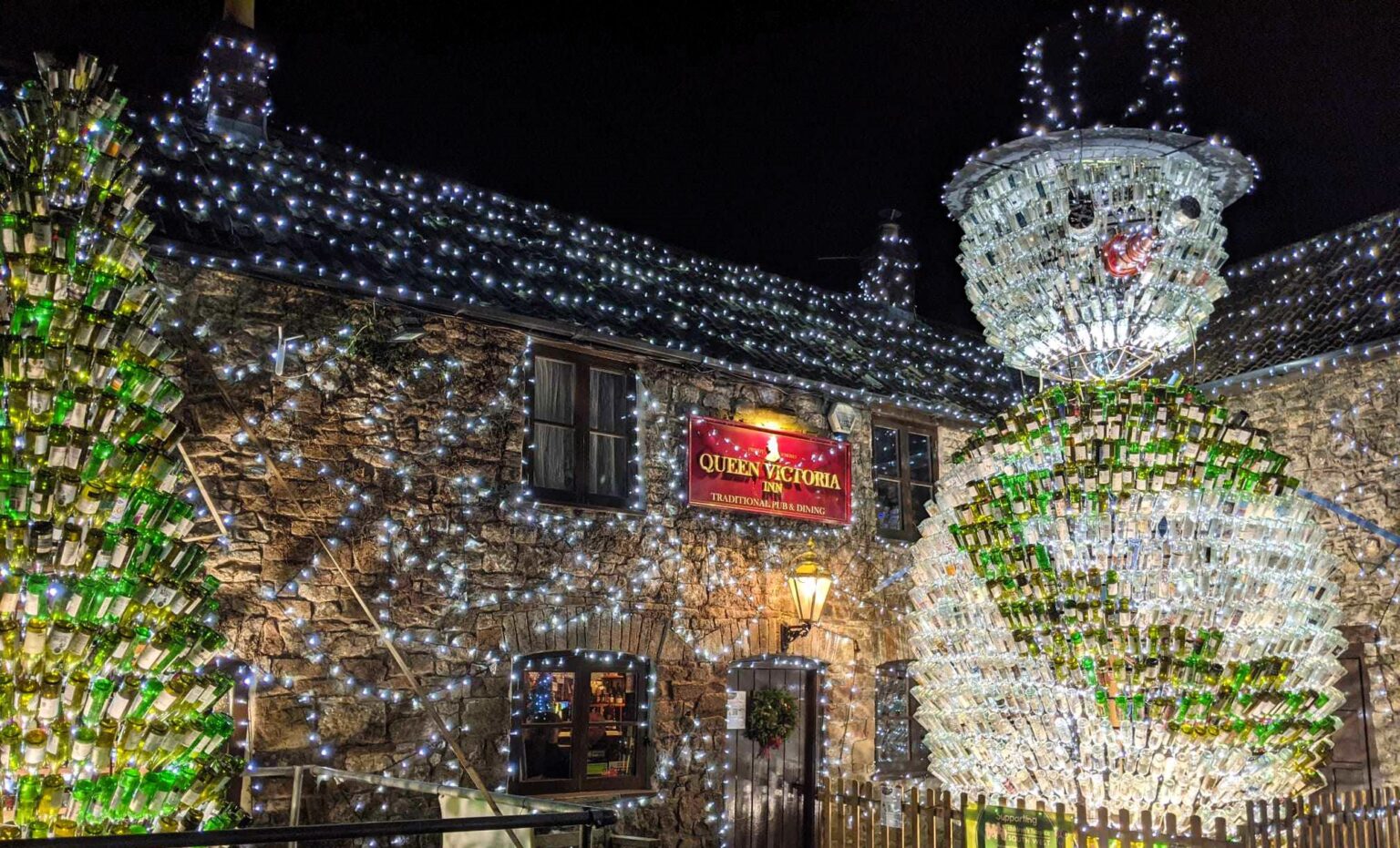 Britain’s most festive pub, The Queen Victoria Inn, stuns with 55,000 lights and a 26ft snowman made of 2,500 wine bottles, raising funds for Children's Hospice South West.