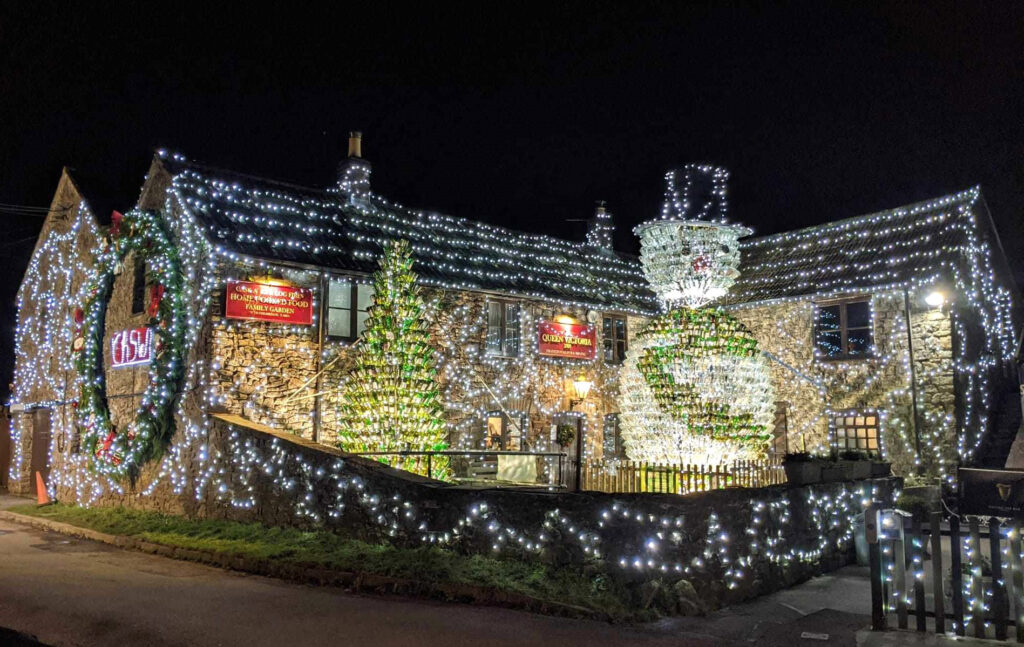 Britain’s most festive pub, The Queen Victoria Inn, stuns with 55,000 lights and a 26ft snowman made of 2,500 wine bottles, raising funds for Children's Hospice South West.