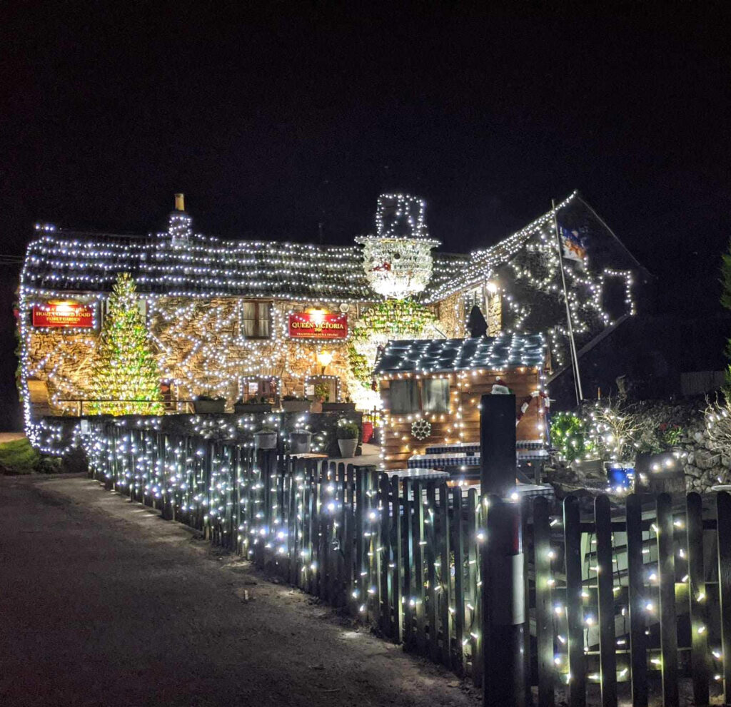 Britain’s most festive pub, The Queen Victoria Inn, stuns with 55,000 lights and a 26ft snowman made of 2,500 wine bottles, raising funds for Children's Hospice South West.