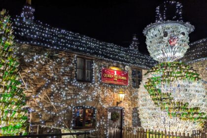 Britain’s most festive pub, The Queen Victoria Inn, stuns with 55,000 lights and a 26ft snowman made of 2,500 wine bottles, raising funds for Children's Hospice South West.