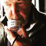 Jeremy Clarkson doubles the price of his cheeky "This Smells Like My Bollocks" candle to £22.50, sparking debate over inflation and festive splurges at Diddly Squat Farm Shop.