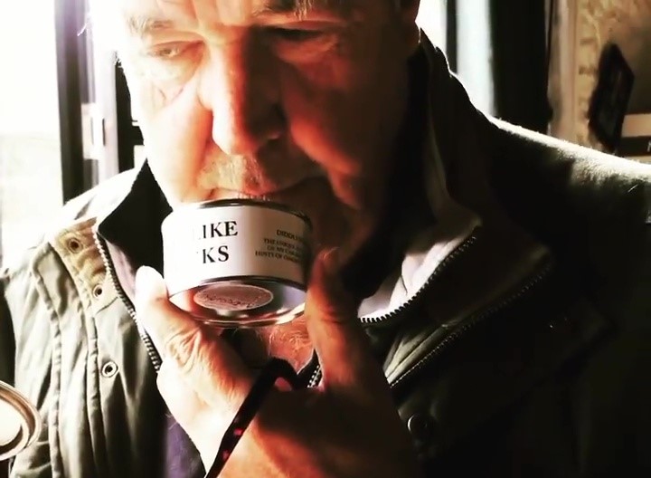 Jeremy Clarkson doubles the price of his cheeky "This Smells Like My Bollocks" candle to £22.50, sparking debate over inflation and festive splurges at Diddly Squat Farm Shop.