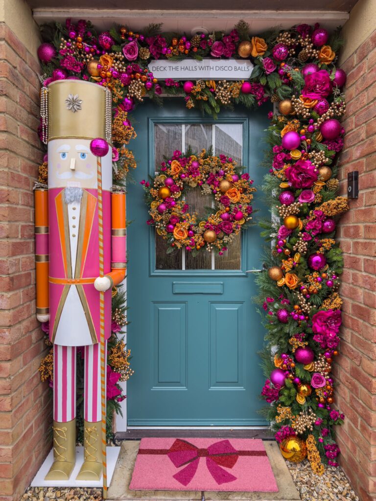 A festive twist in Somerset: Hannah Cape dazzles neighbors with her disco-ball-themed Christmas door, reusing decorations for a sustainable and glittering display.