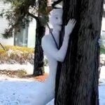 Terrifyingly lifelike snowman spotted in viral video, complete with sculpted fingers, eyes, and muscles. Art or prank? This eerie creation is creeping out Christmas fans!