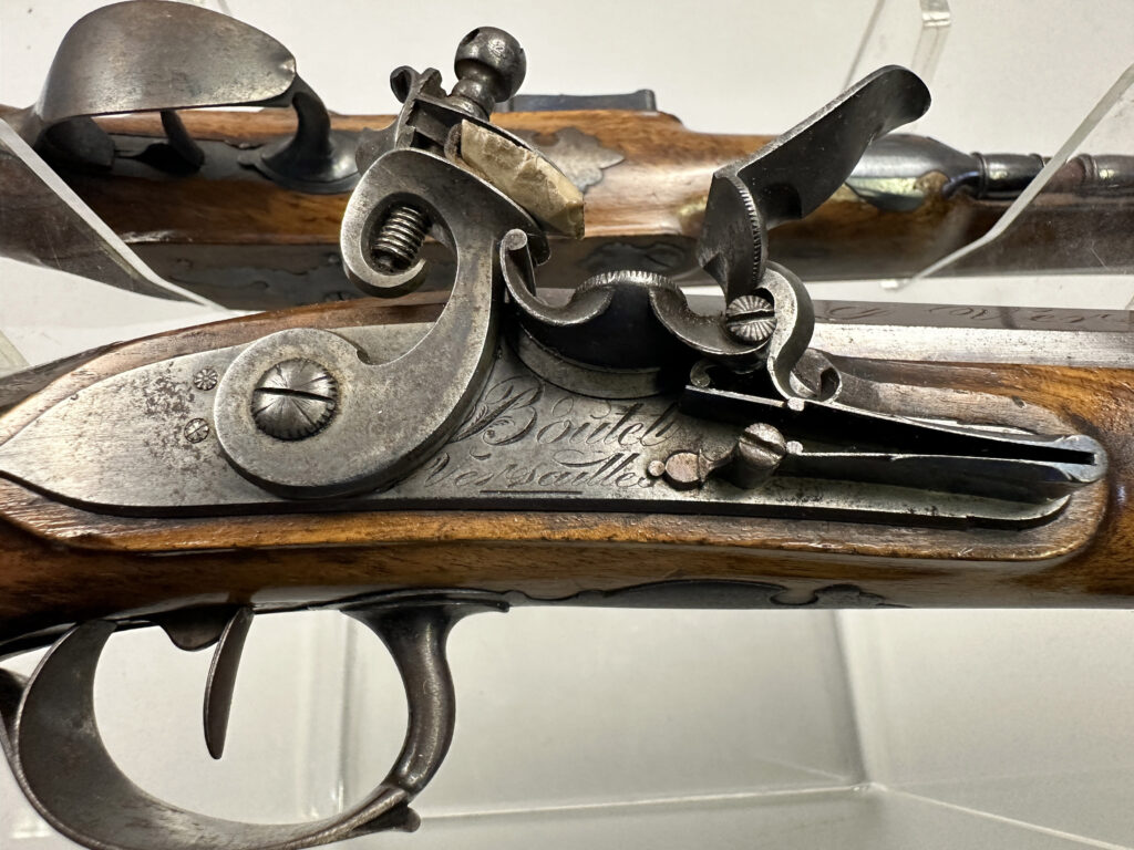 A pair of pistols gifted by Napoleon to a Royal Navy officer after Waterloo sold for £37,500 at Olympia Auctions, marking a historic moment in British and French history.