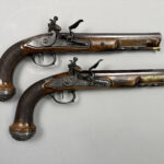 A pair of pistols gifted by Napoleon to a Royal Navy officer after Waterloo sold for £37,500 at Olympia Auctions, marking a historic moment in British and French history.