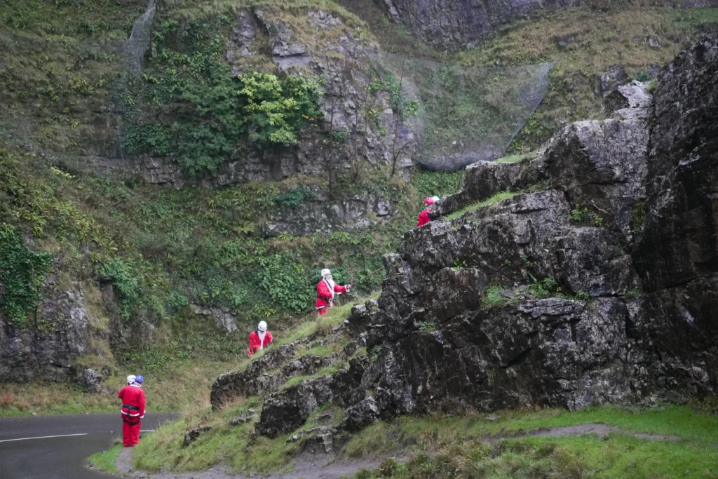 An 82-year-old woman abseiled down Cheddar Gorge dressed as Santa, raising £2,000 for St Margaret's Hospice. The festive event raised £18,500 for end-of-life care in Somerset.