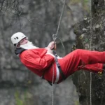 OAP, 82, abseils down iconic 60ft ravine dressed as Father Christmas