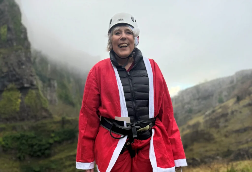 An 82-year-old woman abseiled down Cheddar Gorge dressed as Santa, raising £2,000 for St Margaret's Hospice. The festive event raised £18,500 for end-of-life care in Somerset.