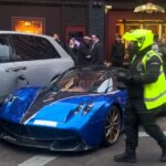 A £2.8M Pagani Huayra parked on double yellows outside Harrods gets ticketed, sparking debate on whether fines deter luxury car owners who see them as "pocket change."