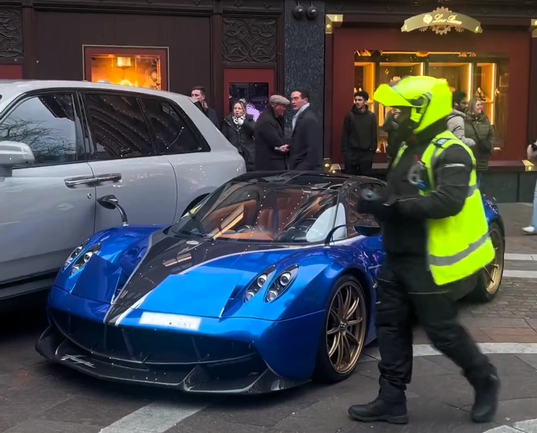 A £2.8M Pagani Huayra parked on double yellows outside Harrods gets ticketed, sparking debate on whether fines deter luxury car owners who see them as "pocket change."