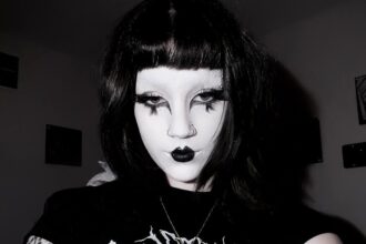 21-year-old Camille Cox embraces goth culture despite public backlash, transforming her look to feel alive and inspiring others to express their true selves boldly.