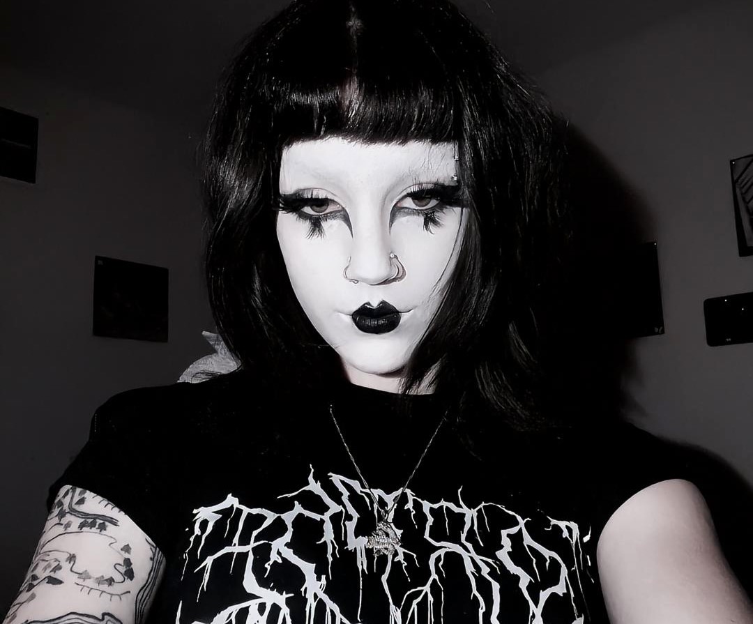 21-year-old Camille Cox embraces goth culture despite public backlash, transforming her look to feel alive and inspiring others to express their true selves boldly.