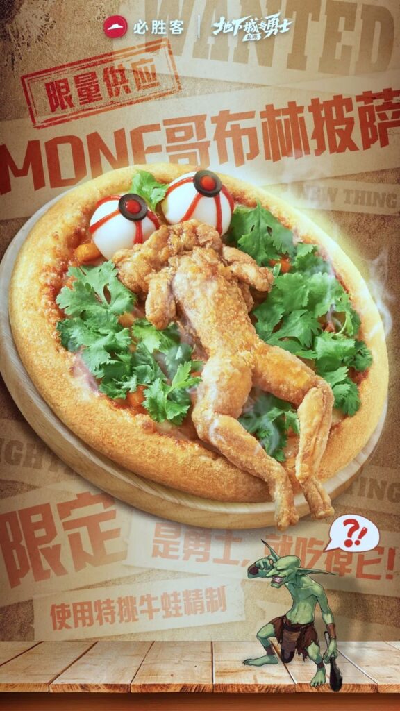 Pizza Hut's 'Goblin Pizza' in China features deep-fried bullfrog, spicy mala flavor, and eerie toppings resembling bulging eyes. Available until Dec 19 for £18.53!