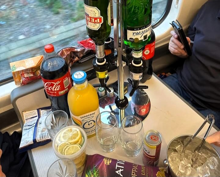 Tottenham fans mocked for bringing a posh bar setup, complete with gin, Pernod, ice, and lemons, on a train to their Europa League clash with Rangers in Glasgow.