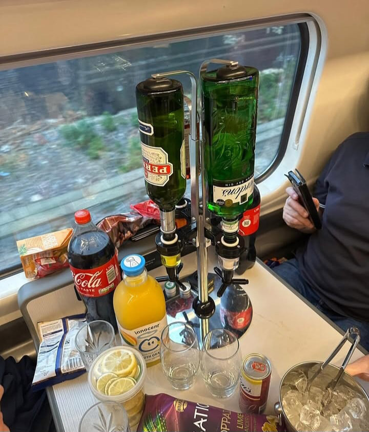 Tottenham fans mocked for bringing a posh bar setup, complete with gin, Pernod, ice, and lemons, on a train to their Europa League clash with Rangers in Glasgow.