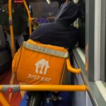 A Just Eat rider was spotted on a late-night London bus with his e-bike, sparking mixed reactions from passengers and locals over TfL's ban on non-foldable bikes.