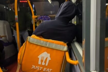 A Just Eat rider was spotted on a late-night London bus with his e-bike, sparking mixed reactions from passengers and locals over TfL's ban on non-foldable bikes.