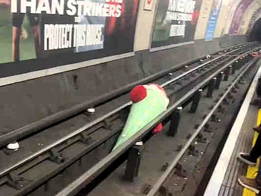 A London Tube train faced delays after a 6ft soft toy chilli pepper ended up on the tracks near Marble Arch, sparking humor and frustration among commuters.