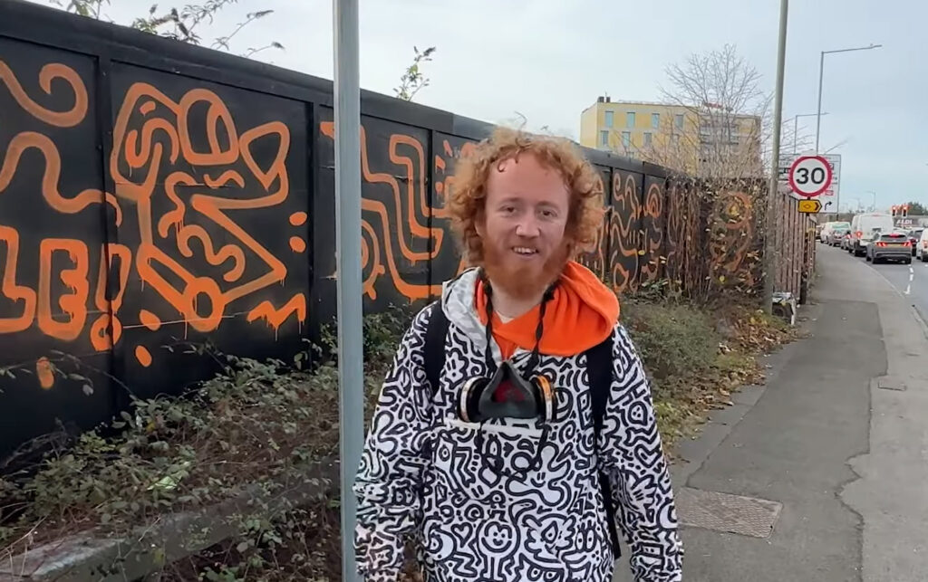 Graffiti artist Mr Doodle creates a stunning 660ft mural in Ashford, Kent, transforming hoardings with his signature style in just one day, sparking local excitement and selfies.