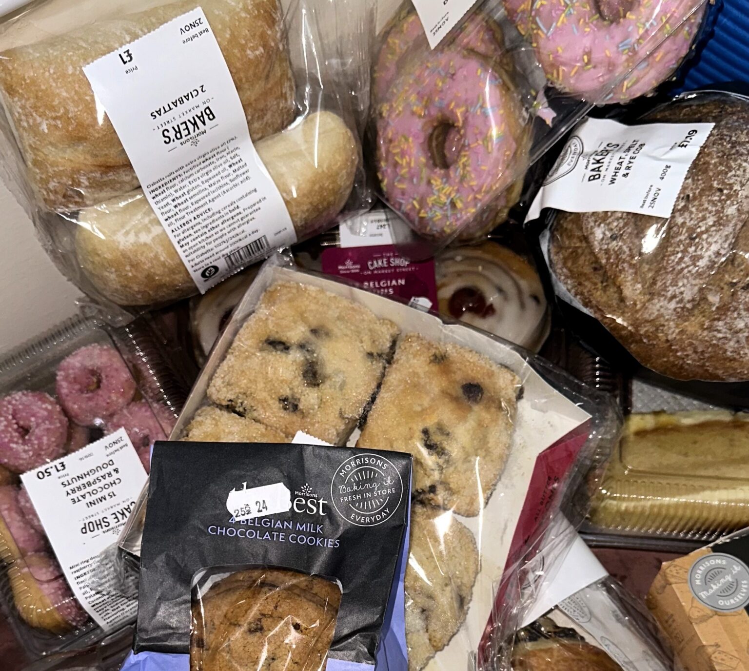 Surprise Morrisons bakery bag stuns shopper with £2 haul: packed with doughnuts, pastries, quiche, and more! Discover the Too Good To Go app's hidden gems.