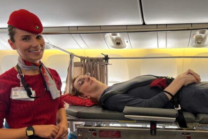 Rumeysa Gelgi, the world’s tallest woman at 7ft 0.09ins, shares her inspiring air travel journey, flying via stretcher due to her condition. A step toward accessible travel!