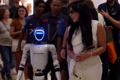 Actress Ingrid Ohara stuns Rio shoppers with robot helpers carrying luxury bags. Futuristic scenes spark awe and confusion, going viral online with global buzz!