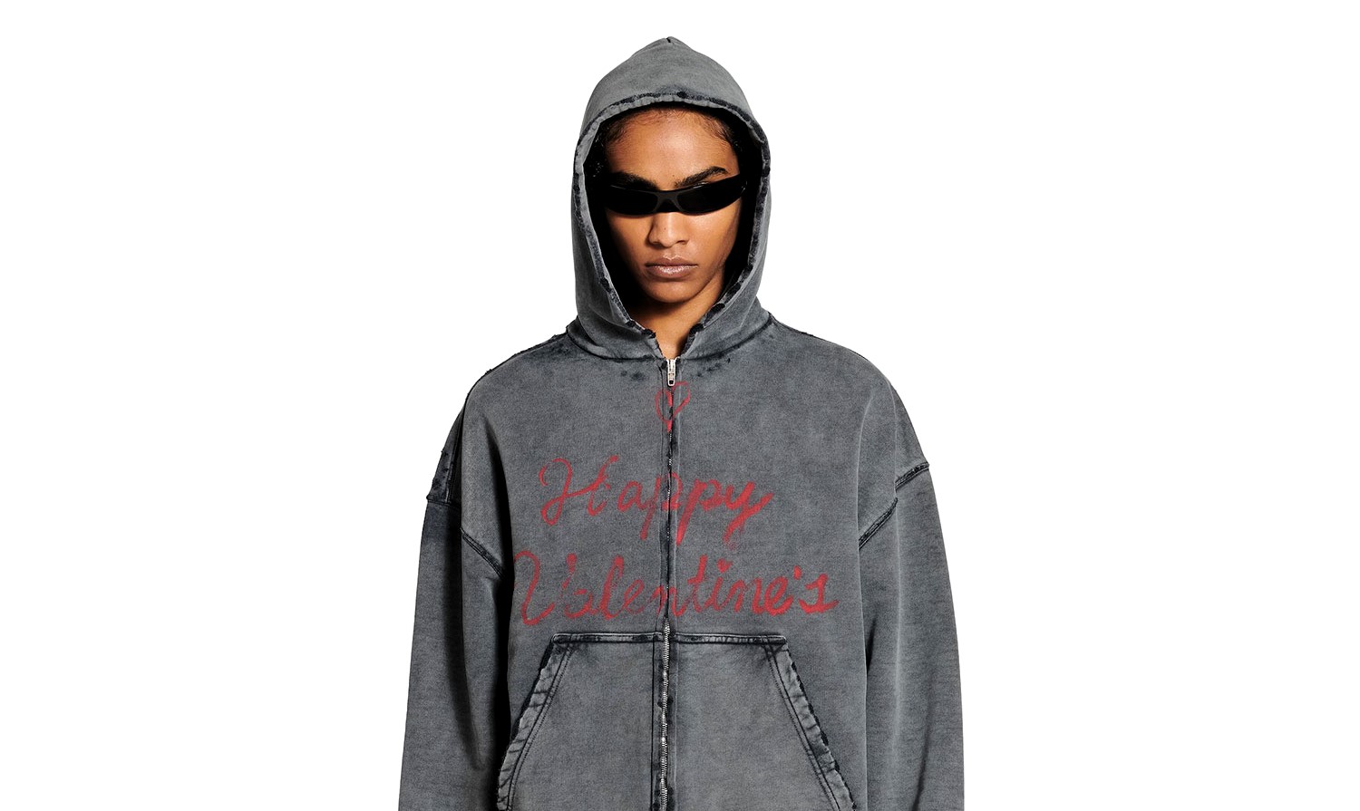 Balenciaga's Valentine’s Day collection features £925 hoodies and £550 tees with lipstick prints and holes, sparking mixed reactions over the bold designs and hefty prices.