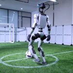 Advanced humanoid G1-Comp robots wow in football trials with agility and precision, hinting at potential appearances in RoboCup 2025 and the World Humanoid Robot Games.