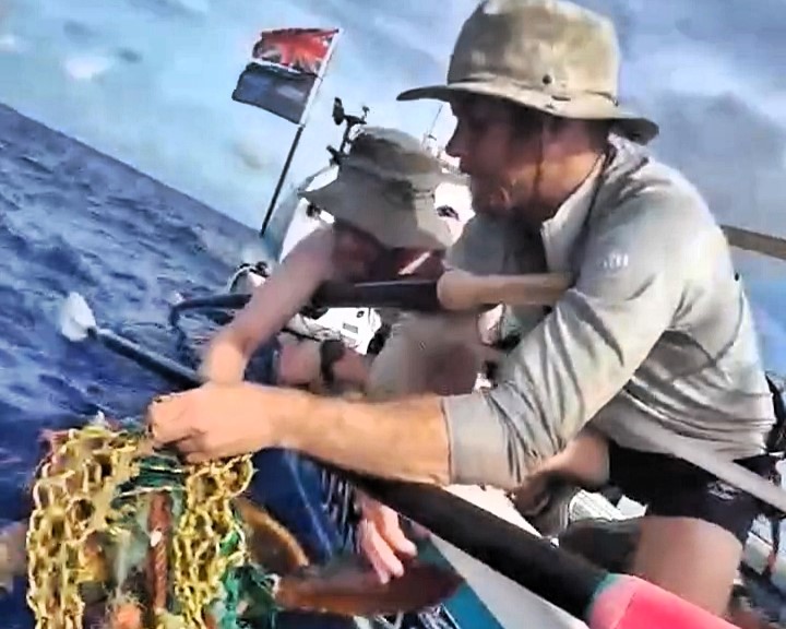 A British rowing team rescued a dying turtle tangled in fishing net mid-Atlantic during their Talisker Whisky Atlantic Rowing Challenge, showcasing teamwork and care for marine life.