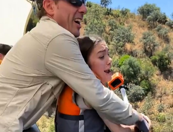 A bungee jump instructor in Spain faced backlash after pushing a terrified woman off a bridge despite her protests, sparking debate online about safety and consent in extreme sports.