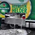 A Heineken truck in the Netherlands accidentally spilled beer onto the street due to a faulty valve, flooding the road with booze. Locals captured the moment as beer flowed into drains.