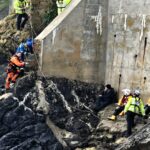 A couple and their dog were rescued in Tenby after being trapped by an incoming tide. Lifeboat, coastguard, and helicopter teams ensured their safe escape.